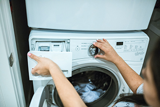 employee at laundry machine