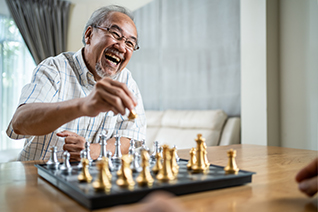 elderly man playing chess